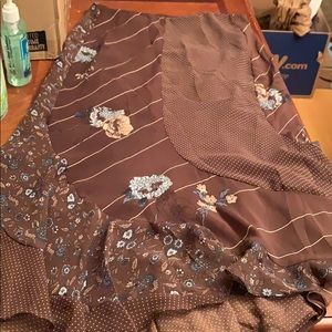 Size 6  skirt. Below knee. Lined sheer top layer.